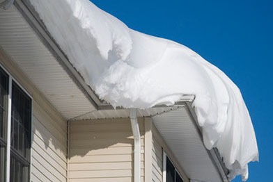 35553855 snow drift on roof after two days of snowfalls